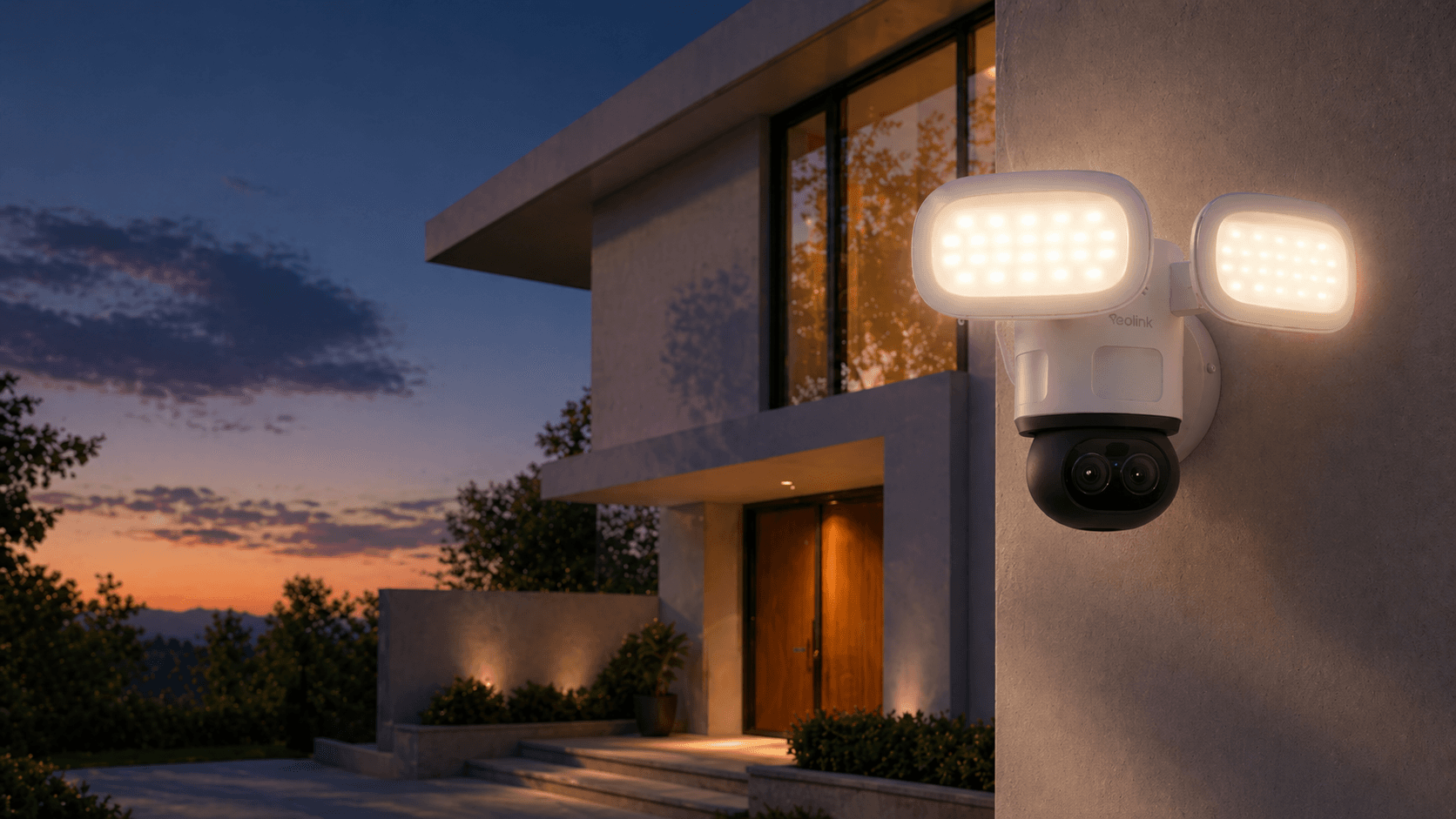 Reolink TrackFlex Floodlight WiFi mounted on a modern home's exterior with security lighting at sunset