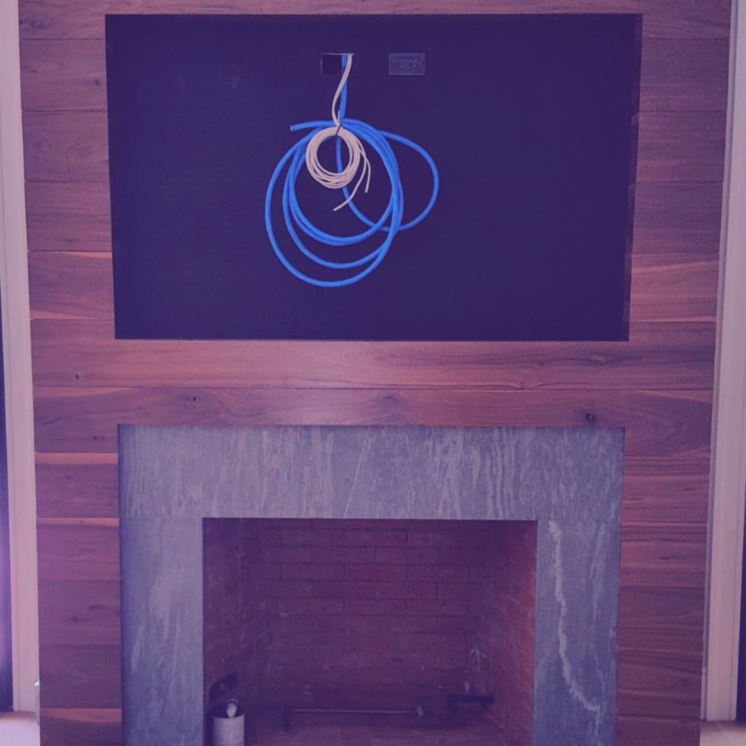 In-progress TV wall with planned in-wall power and low-voltage routing